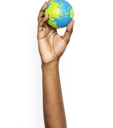 hand-holding-a-globe-ball-AY9LSVR